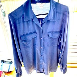 Women’s purple button down shirt.